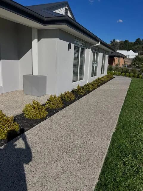 Fresh exterior walls and trim beside a landscaped pathway