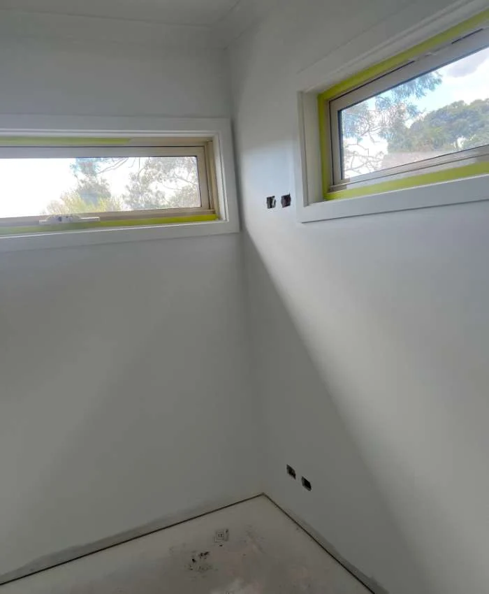 Fresh interior paintwork around masked windows