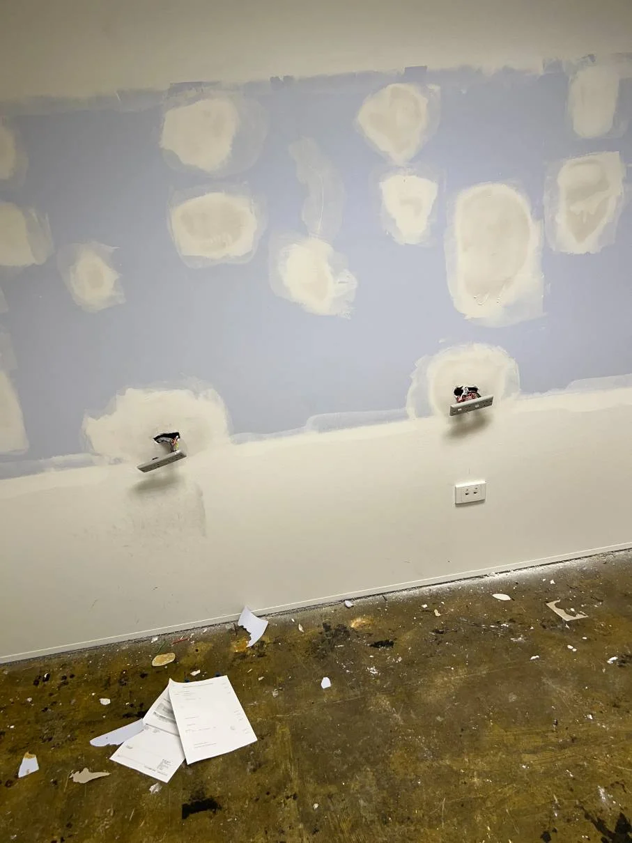 Wall preparation with filled patches before painting
