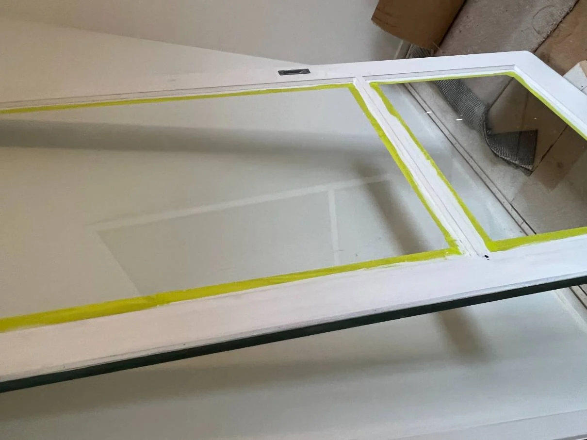 Door repaint with glass masked during preparation
